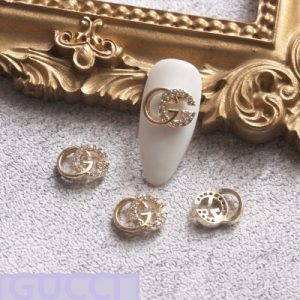gold gucci nail charms