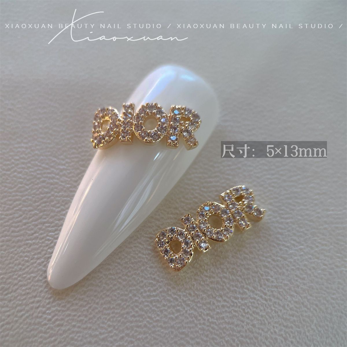 Dior nail charm gold